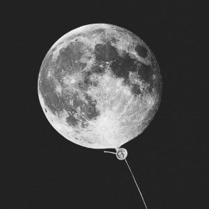 Moon wall art of white moon displayed as a balloon on a strong by icanvas artist Jonas Loose