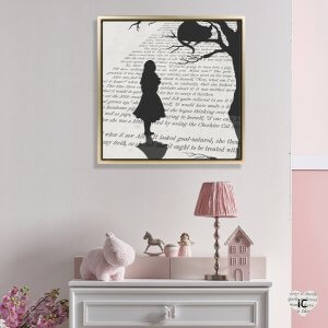 Book page art of Alice in Wonderland text with silhouette of her, cat and tree framed in girl’s room by icanvas artist Peter Walters