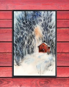 A red barn surrounded by a snow covered forest.