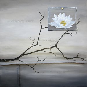 A lotus flower on top of branches above water