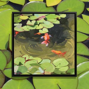 Orange fish in pond surrounded by lily pads