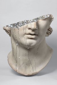 Greek sculpture with glitter pouring out of head