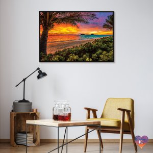 Colorful sunset on beach with palm trees