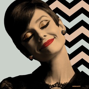 Audrey Hepburn with gold eyeshadow and Chanel earrings