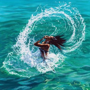 Woman splashing her hair above the water