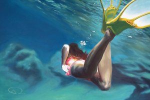 Woman diving in water with flippers on feet