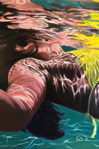 Closeup of woman underwater with yellow bathing suit