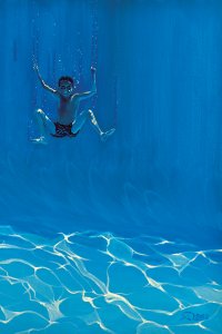 Young boy diving underwater with goggles