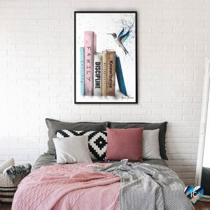 Vertical stack of books with hummingbird nearby and bursts of colors