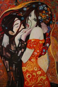 Man holding woman with patterned dress and patterns in her hair