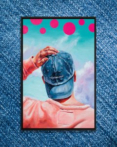 Backside of man wearing Calvin Klein Jeans hat looking up at sky