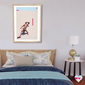 Shirtless man lying down in sand