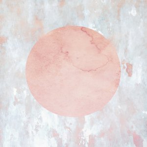 Large pink moon in front of abstract background
