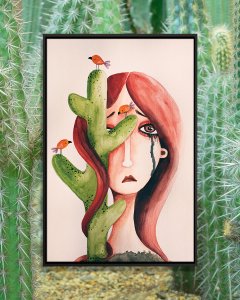 wbc-lifestyle-FMM42 Crying woman with cactus on half her face and little birds on it