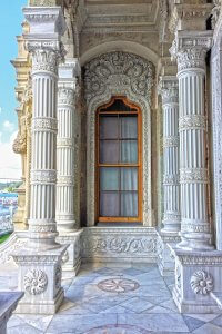 Detailed columns with a decorative frame around a window