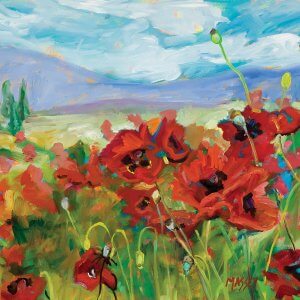 Red flowers in a field with a bright blue cloudy sky