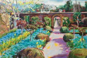 A pathway in between a colorful garden with an archway