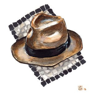 Brown hat on top of a pebble design