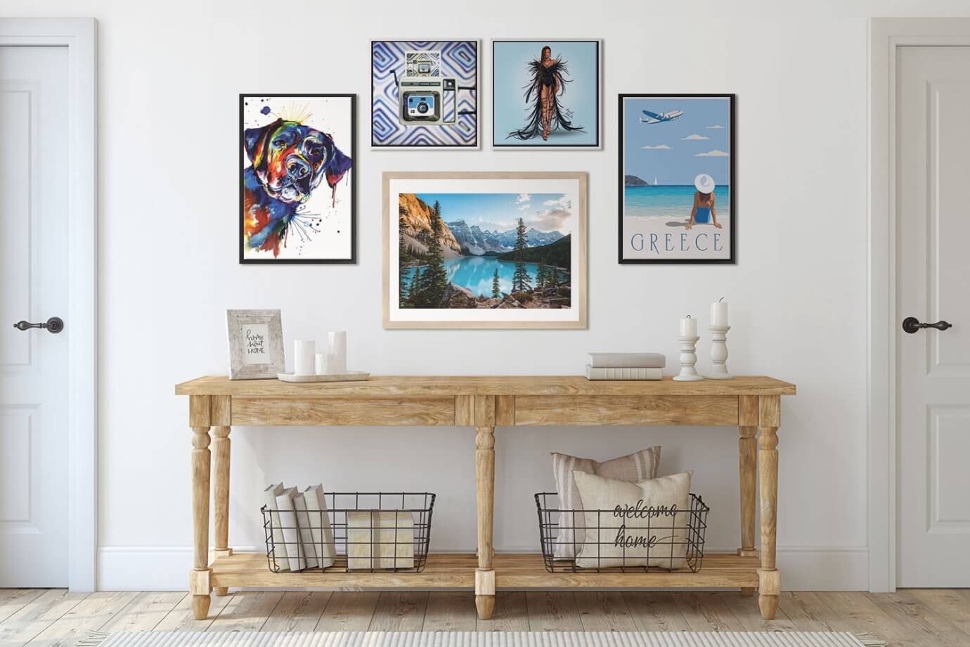 gallery wall of art above a wood entryway table