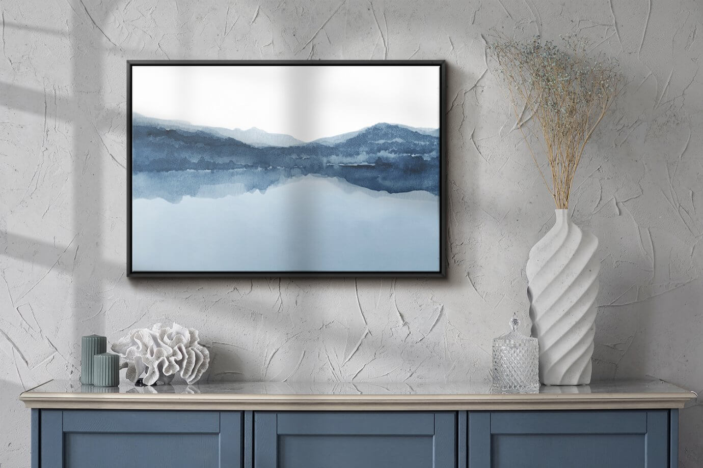 Blue watercolor moutain art hanging on wall