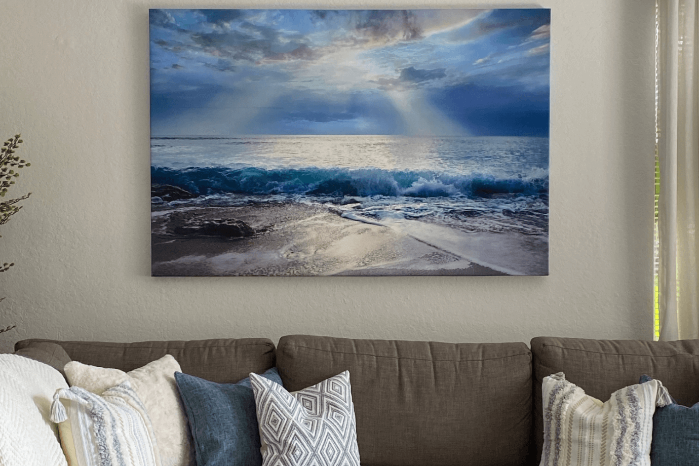 ocean photography art hanging above couch