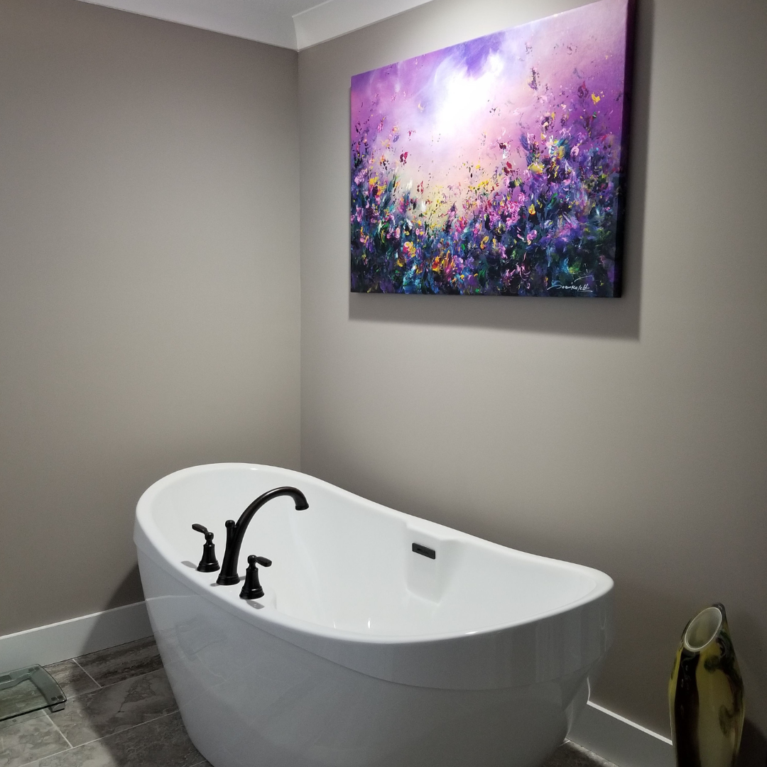 purple flower field painting above bathtub