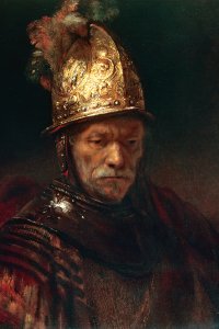 portrait of an elderly man wearing a gold helmet
