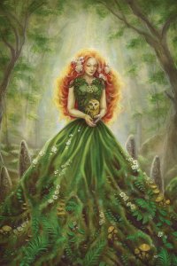Woman in green dress with red hair holding an owl while standing in a forest