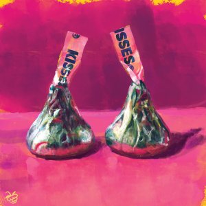 two hershey's kisses with a pink background