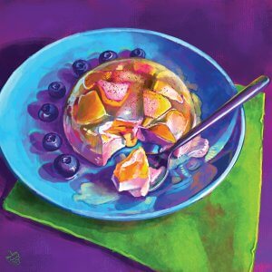 blue plate with a peach panna cotta and blueberries