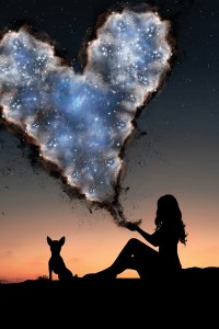 AEV26 woman sitting outside in the dark holding a sparkly cloud in the shape of a heart next to a dog