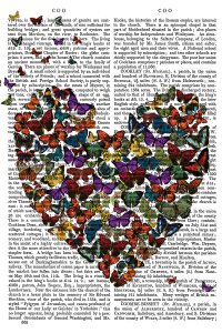FNK1329 butterflies gathered into the shape of a heart against a book page background