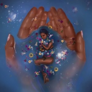 Hands holding a woman lying in blue water surrounded by flowers
