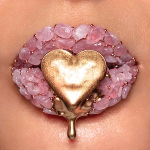 VHA148 lips covered in pink stones with a dripping gold heart in the center