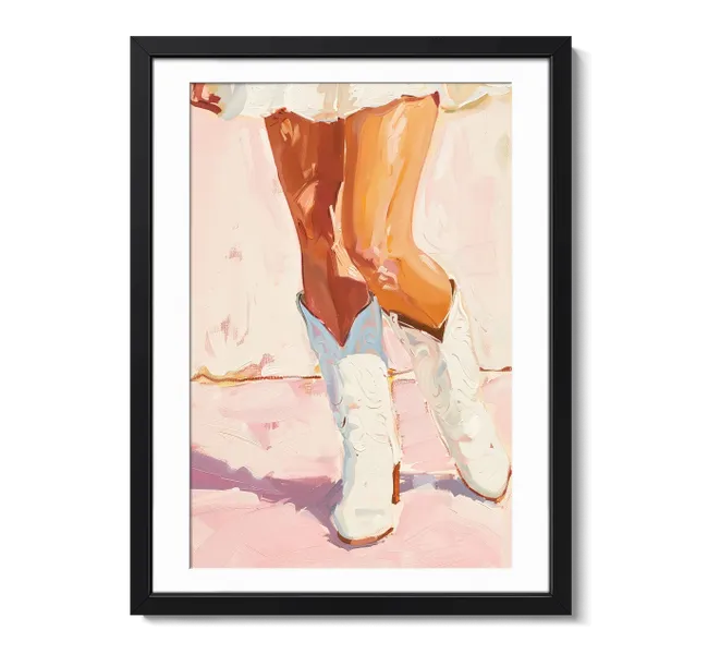 legs with white cowboy boots on pink ground