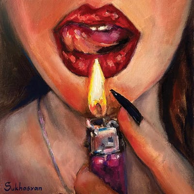 woman holding a lighter to her mouth