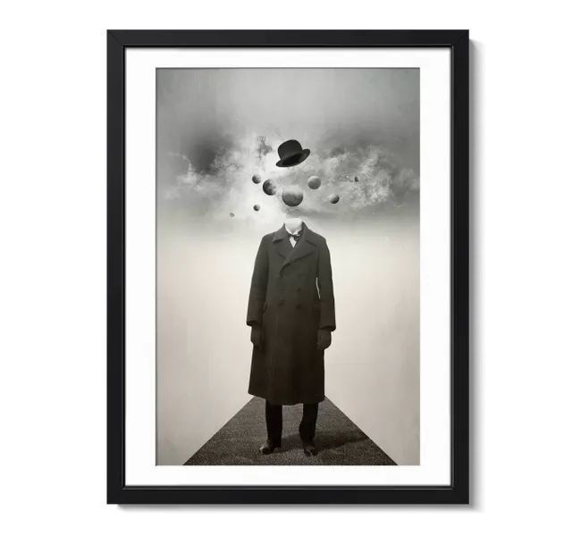 Black and white photo of man in long jacket with planets in place of his head
