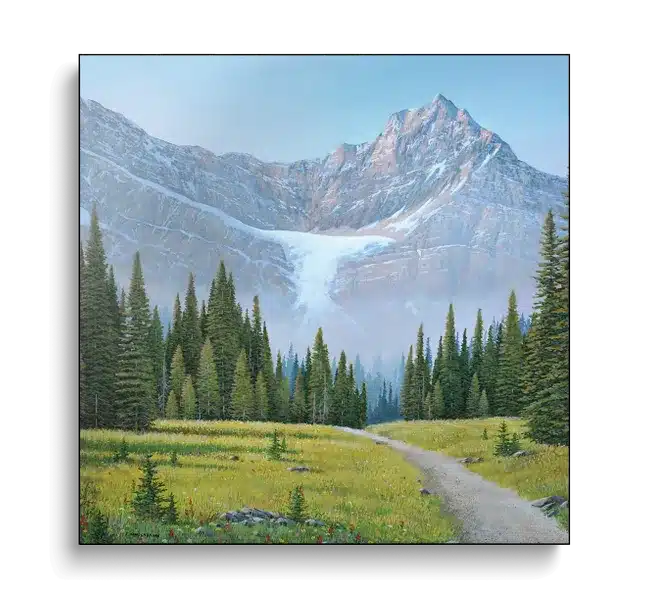 Path surrounded by trees leading to mountains