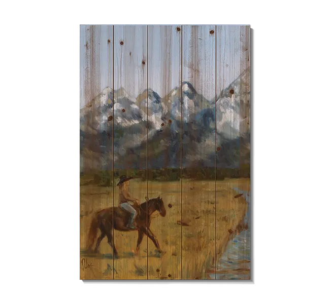 Woman riding a horse near the mountains