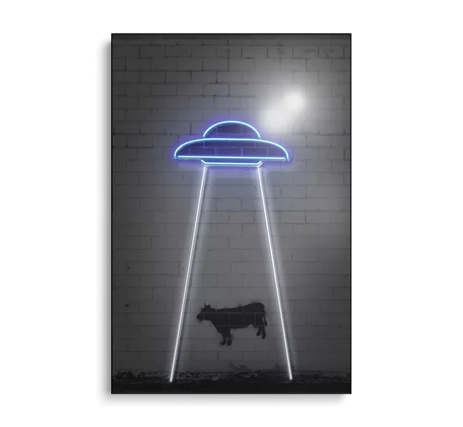 Cow underneath neon spaceship sign
