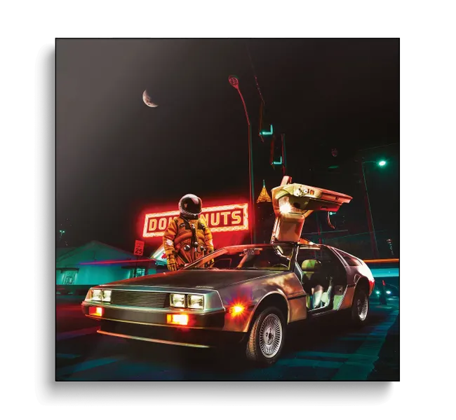 Astronaut next to a car with a neon light up sign