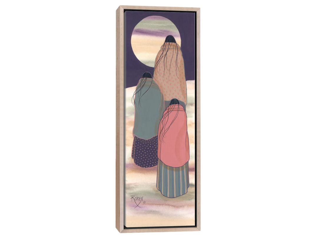 native american women in colorful blankets staring at the full moon