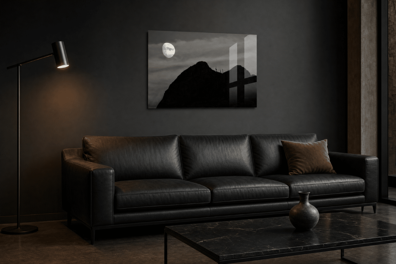 black and white mountain photography above couch