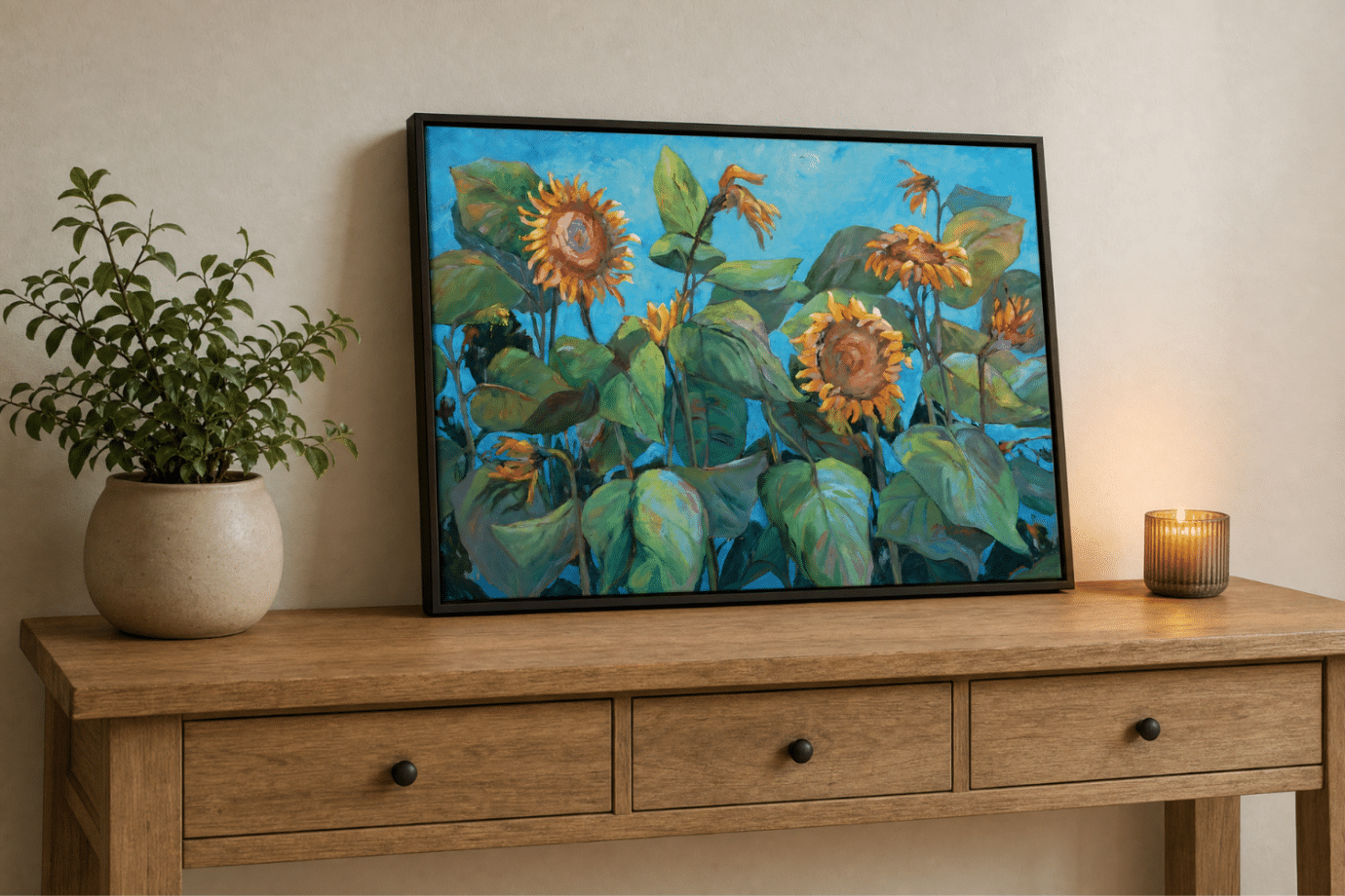 framed sunflower artwork on table