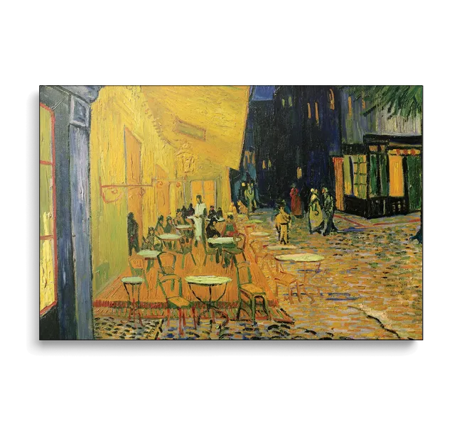 yellow cafe exterior with seating and cobblestone streets