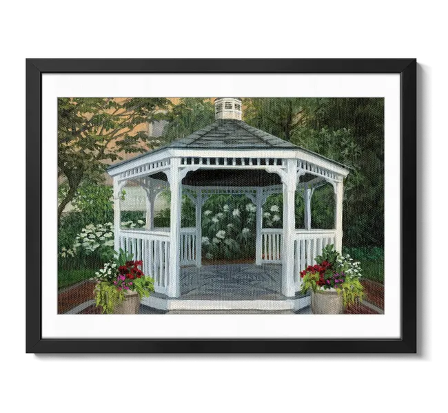 white gazebo surrounded by flowers