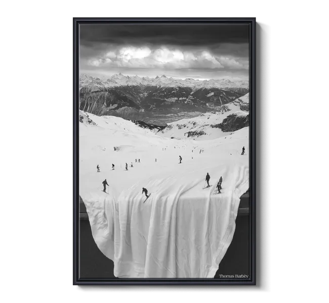 people skiing on a white sheet in mountains