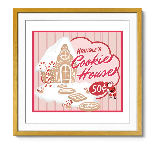 gingerbread house covered in snow with candy canes and the words "Kringle's Cookie House"