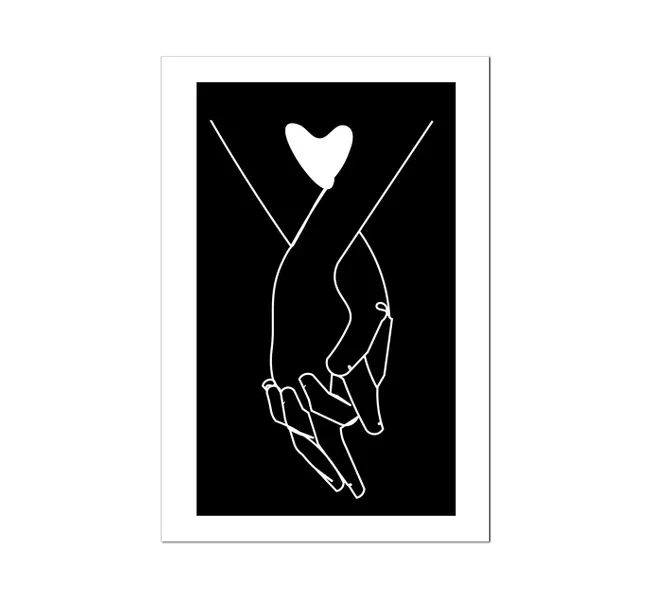 hands intertwined with a heart against a black background