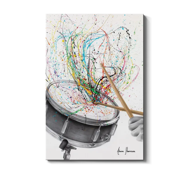 splashes of color coming off a drum set with hands holding drum sticks